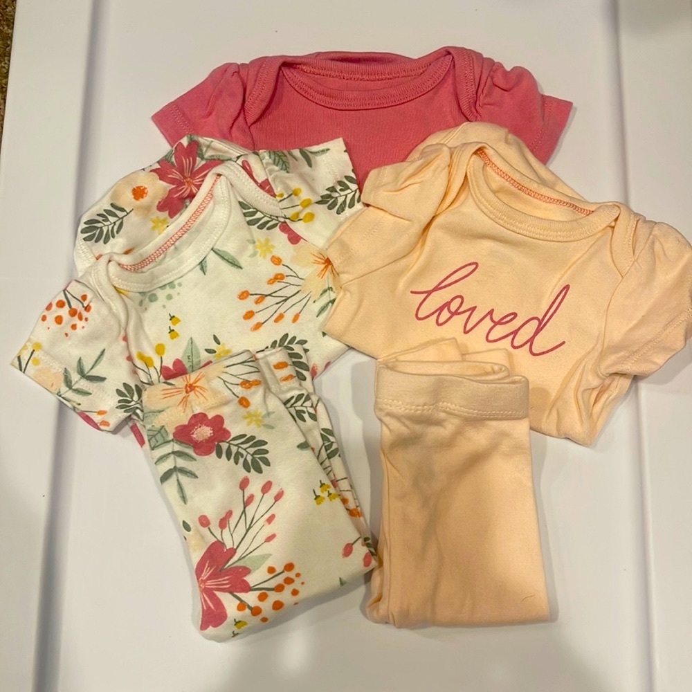 3 onesie and 2 pair of leggings that all match!  Newborn